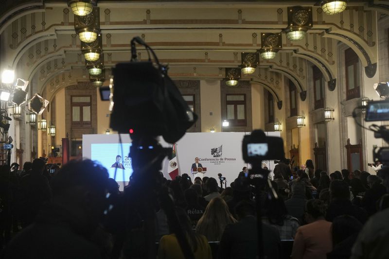 Mexican President Claudia Sheinbaum gives a media briefing from the National Palace in Mexico City, Wednesday, Oct. 2, 2024, the morning after her inauguration. (AP Photo/Fernando Llano)