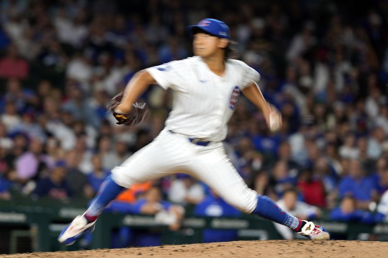 In this image taken with a slow shutter speed, Chicago Cubs pitcher Shota Imanaga throws during the fifth inning of a baseball game against the Pittsburgh Pirates on Wednesday, Sept. 4, 2024, in Chicago. (AP Photo/Charles Rex Arbogast)