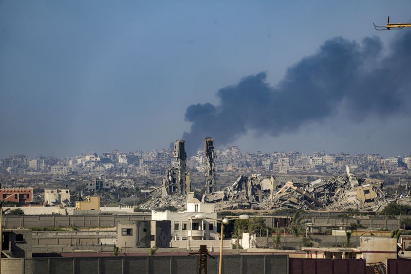 Smoke rises following an Israeli airstrike in the central Gaza Strip, Wednesday, July 10, 2024. (AP Photo/Abdel Kareem Hana)