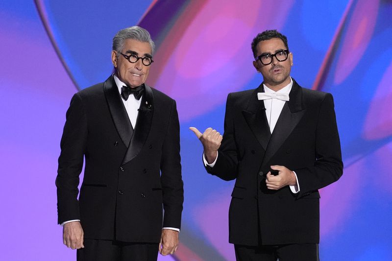 Hosts Eugene Levy and Dan Levy speak during the 76th Primetime Emmy Awards on Sunday, Sept. 15, 2024, at the Peacock Theater in Los Angeles. (AP Photo/Chris Pizzello)