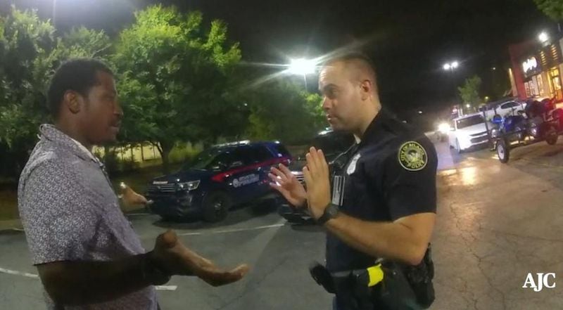 Rayshard Brooks talks with Atlanta Police Officer Garrett Rolfe in Wendy’s parking lot before Rolfe shoots him in the back, killing him. (Contributed)