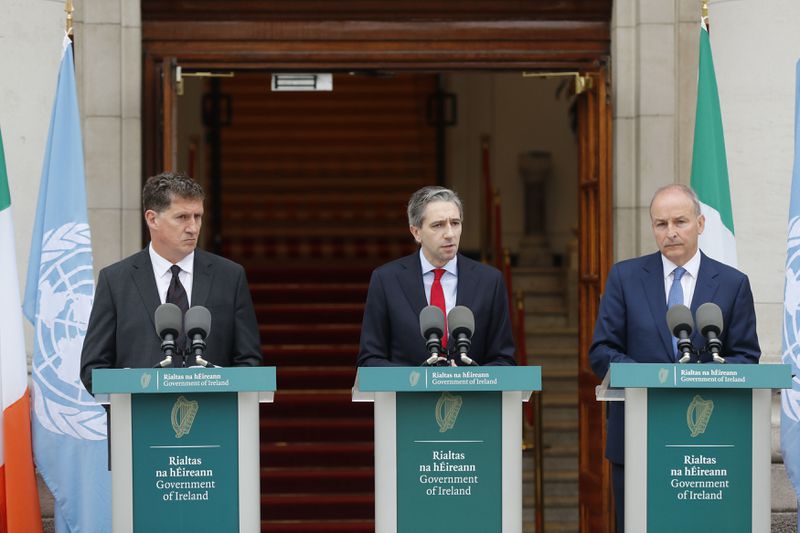 The three Irish Government leaders from left, Minister Eamon Ryan, Taoiseach Simon Harris and Tanaiste Micheal Martin speak to the media during a press conference outside the Government Buildings, in Dublin, Ireland, Wednesday May 22, 2024. Ireland and Spain have recognized a Palestinian state. Irish Prime Minister Simon Harris said Wednesday it was a move coordinated with Spain and Norway, “an historic and important day for Ireland and for Palestine.” He said the move was intended to help move the Israeli-Palestinian conflict to resolution through a two-state solution. (Damien Storan/PA via AP)