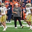 Georgia Tech head coach Brent Key instructs his players during the first half of an NCAA football game against Syracuse, Saturday, Sept. 7, 2024 in Syracuse, N.Y. (AP Photo/Hans Pennink)