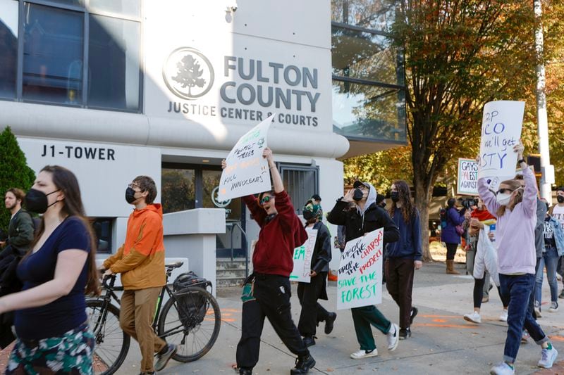 Dozens walk from Underground Atlanta to Fulton County Courthouse in support of the 61 activists indicted for racketeering on Monday, Nov. 6, 2023. Sixty one (Natrice Miller/ Natrice.miller@ajc.com)