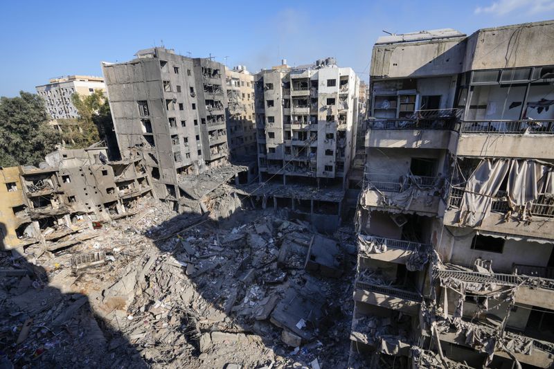 Damaged buildings at the site of the assassination of Hezbollah leader Hassan Nasrallah in Beirut's southern suburbs, Sunday, Sept. 29, 2024. (AP Photo/Hassan Ammar)