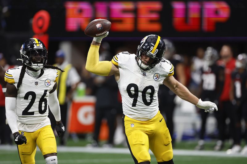 Pittsburgh Steelers linebacker T.J. Watt (90) celebrates after recovering a fumble during the second half of an NFL football game against the Atlanta Falcons on Sunday, Sept. 8, 2024, in Atlanta. (AP Photo/Butch Dill)