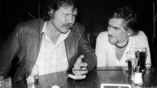 Writers Harry Crews and Paul Hemphill at Manuel's Tavern on April 16, 1979. AJC File