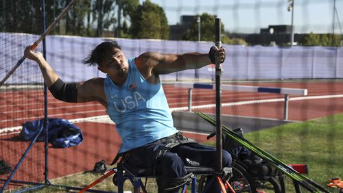 Justin Phongsavanh of the U.S. throws his javelin during a media tour of the U.S. team High Performance Center during the Paralympic Games in Paris on Wednesday, Aug. 28, 2024. (AP Photo/Avni Trivedi)