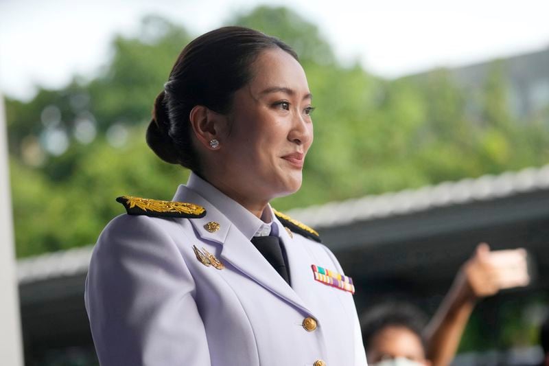 Thailand newly elected Prime Minister Paetongtarn Shinawatra, waits for her father and former Prime Minister Thaksin Shinawatra before the royal endorsement ceremony appointing Paetongtarn as Thailand's new prime minister at Pheu Thai party headquarters in Bangkok, Thailand, Sunday, Aug. 18, 2024. (AP Photo/Sakchai Lalit)