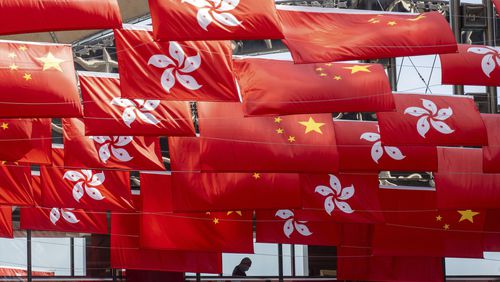 FILE - China and Hong Kong flags are hung as the city marks China's national day in Hong Kong, Sunday, Oct. 1, 2023. (AP Photo/Chan Long Hei, File)