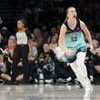 New York Liberty guard Sabrina Ionescu (20) reacts after a three-point- basket during the first half of a WNBA Semifinal game against the Las Vegas Aces, Sunday, Oct. 6, 2024, in Las Vegas. (AP Photo/Ian Maule)