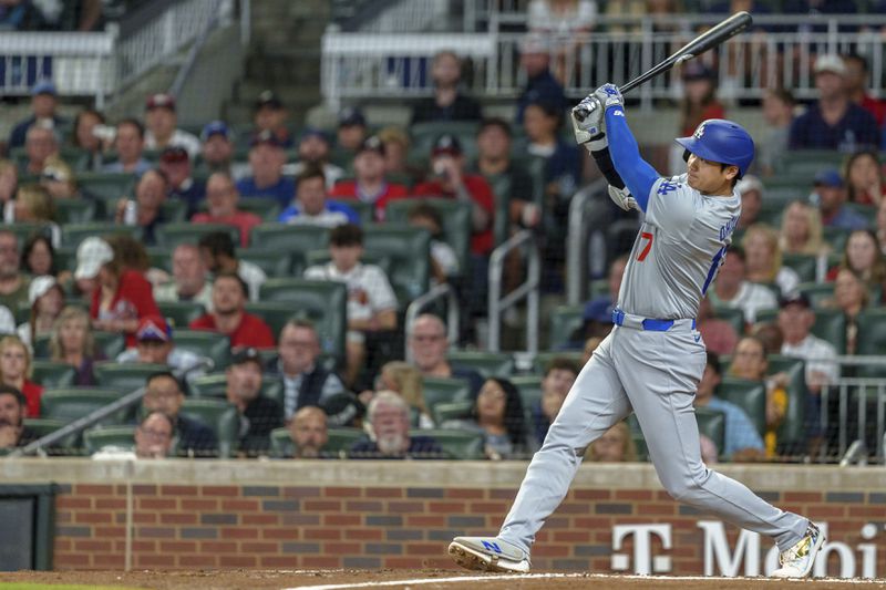 Los Angeles Dodgers' Shohei Ohtani hits a double to right field in the fifth inning of a baseball game against the Atlanta Braves, Sunday, Sept. 15, 2024, in Atlanta. (AP Photo/Jason Allen)