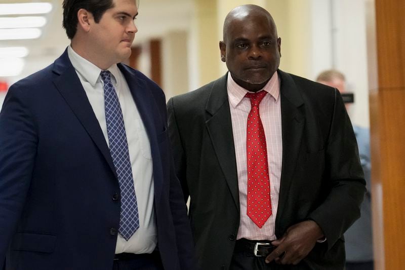 Retired Houston Police Department officer Gerald Goines, right, goes back to the 482nd District Court after a brief break Monday, Sept. 9, 2024, at the Harris County Criminal Courthouse in Houston. Goines was on trial on two felony murder charges in the January 2019 deaths of Dennis Tuttle and Rhogena Nicholas. (Yi-Chin Lee/Houston Chronicle via AP)