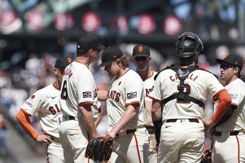 San Francisco Giants' Logan Webb, third from left, walks past manager Bob Melvin (6) as he exits during the eighth inning of a baseball game against the Atlanta Braves, Thursday, Aug. 15, 2024, in San Francisco. (AP Photo/Godofredo A. Vásquez)