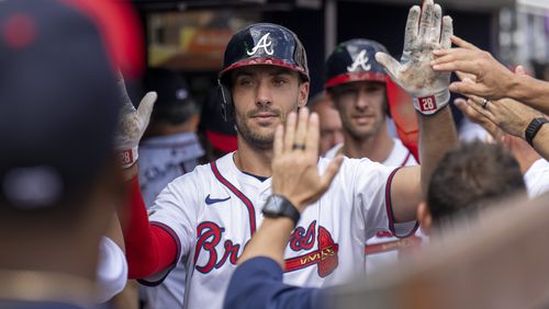 Atlanta Braves Matt Olson celebrates after scoring a run during the ninth inning of a baseball game against the Toronto Blue Jays, Sunday, Sept. 8, 2024, in Atlanta. (AP Photo/Erik Rank)