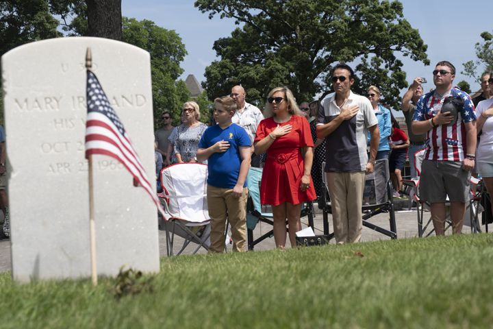 People say the Pledge of Allegiance during the Memorial Day ceremony at Marietta National Cemetery on Monday, May 27, 2024. (Ben Gray / Ben@BenGray.com)