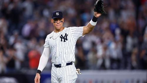 Aaron Judge waves to fans after the New York Yankees clinched the American League East title, Thursday, Sept. 26, 2024, in New York. (AP Photo/Noah K. Murray)