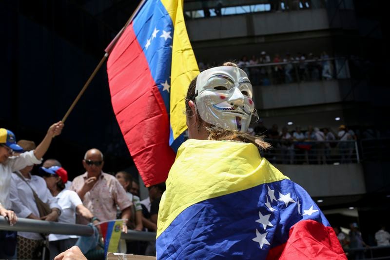 Opposition supporters protest the reelection of President Nicolás Maduro one month after the disputed vote, which opposition leaders claim they won by a landslide, in Caracas, Venezuela, Wednesday, Aug. 28, 2024. (AP Photo/Cristian Hernandez)