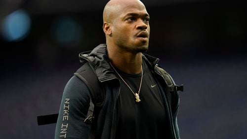 FILE - Seattle Seahawks running back Adrian Peterson looks on during player arrivals before an NFL football game against the Houston Texans, Dec. 12, 2021, in Houston. (AP Photo/Matt Patterson, File)