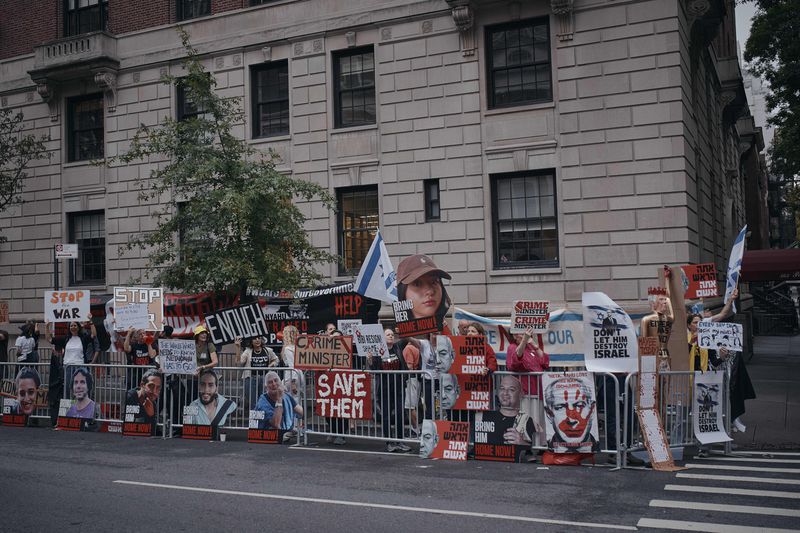 People protest against Prime Minister of Israel Benjamin Netanyahu during the 79th session of the United Nations General Assembly, in New York, on Friday, Sept. 27, 2024. (AP Photo/Andres Kudacki)