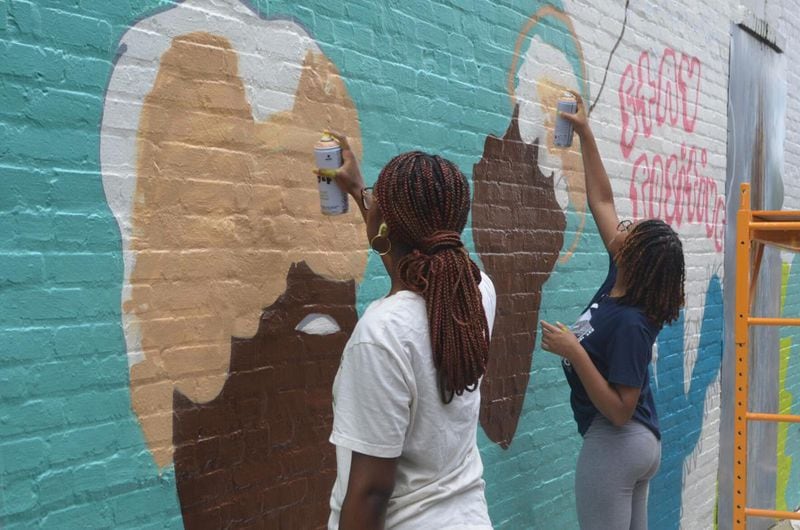 The new mural has colorful images of rainbows, turtles, ice cream, silhouettes of Black women and encouraging phrases. (Photo Courtesy of Lucille Lannigan)