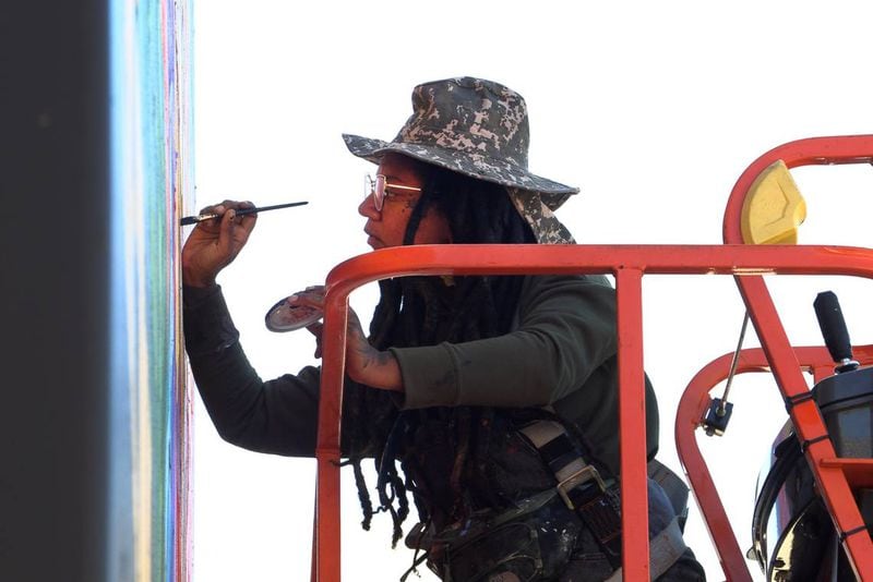 Charity Hamidullah is the muralist creating a new mural at Highside Market in Columbus, Georgia. (Photo Courtesy of Mike Haskey)