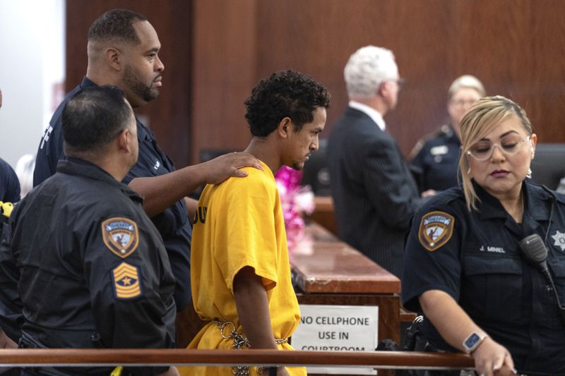 Franklin Peña, one of the two men accused of killing 12-year-old Jocelyn Nungaray, is led into the courtroom, Monday, June 24, 2024, in Houston. Peña was ordered held on $10 million bail as he and another man, Johan Jose Rangel-Martinez, are charged with capital murder over the girl's death. (Brett Coomer/Houston Chronicle via AP)