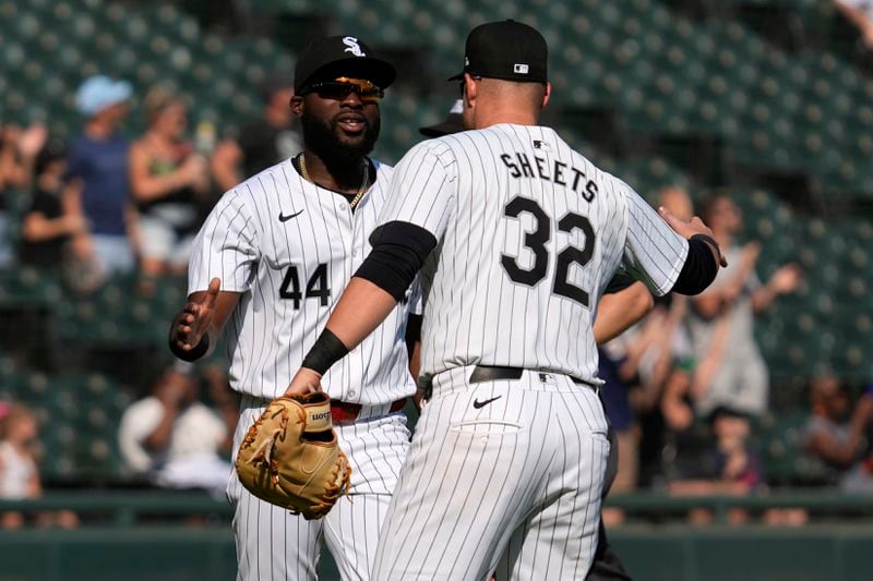 Chicago White Sox's Bryan Ramos, left, celebrates with Gavin Sheets after the White Sox defeated the Oakland Athletics in a baseball game in Chicago, Sunday, Sept. 15, 2024. (AP Photo/Nam Y. Huh)