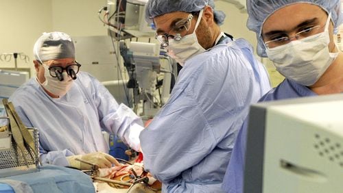 Columbia University Medical Center Transplant Services surgeons watch a monitor as they perform a liver transplant at New York-Presbyterian Hospital in New York. (PHOTO by Keelin Daly/Hearst Connecticut Media via AP, File)