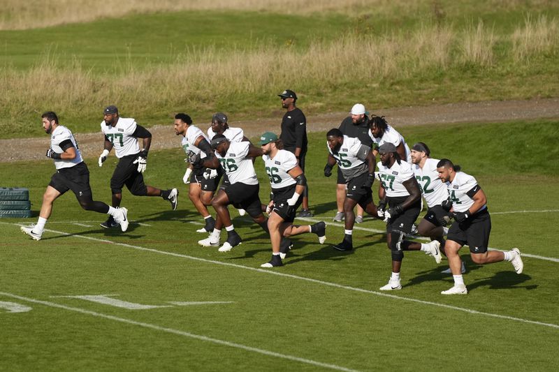 New York Jets center Joe Tippmann (66) and teammates participate in a training session in Ware, England, Friday, Oct. 4, 2024, ahead of the game between New York Jets and Minnesota Vikings at the Tottenham Hotspur stadium on Sunday. (AP Photo/Alastair Grant)