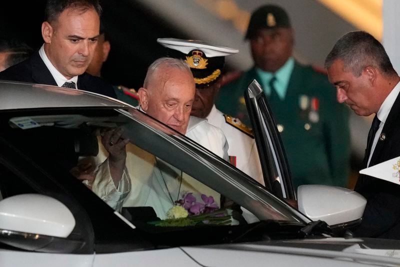 Pope Francis boards a waiting car at Jackson's International Airport in Port Moresby, Papua New Guinea, Friday, Sept. 6, 2024. (AP Photo/Mark Baker)