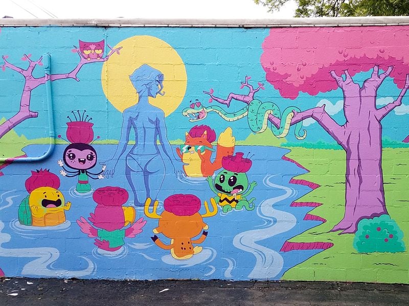 Muralist Mario Daniel has fun with his cartoon figures and lovelorn snake in “Our Lady of the Lotus Eaters.”