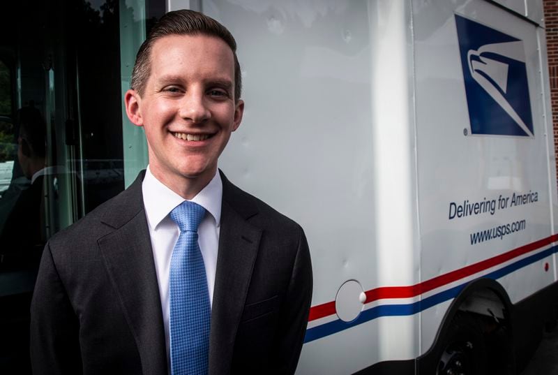 Patrick Ecker, executive manager of fleet services for the U.S. Postal Service, stands in front of a new mail delivery truck on Thursday, Sept. 5, 2024, in Athens, Ga. (AP Photo/Ron Harris)