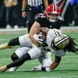 Atlanta Falcons linebacker Troy Andersen (44) stops New Orleans Saints running back Alvin Kamara (41) during the first half of an NFL football game against the New Orleans Saints on Sunday, Sept. 29, at Mercedes-Benz Stadium in Atlanta.

(Miguel Martinez/ AJC)