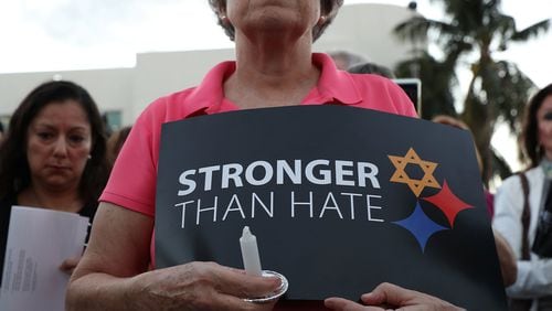 MIAMI BEACH, FL - OCTOBER 30: A person holds a sign as she joins with others for a community-wide Solidarity Vigil at the Holocaust Memorial Miami Beach to remember the victims of the mass shooting at a Pittsburgh synagogue on October 30, 2018 in Miami Beach, Florida. Eleven people were killed in an attack at the Tree of Life Congregation in Pittsburgh’s Squirrel Hill neighborhood on Oct. 27. (Photo by Joe Raedle/Getty Images)