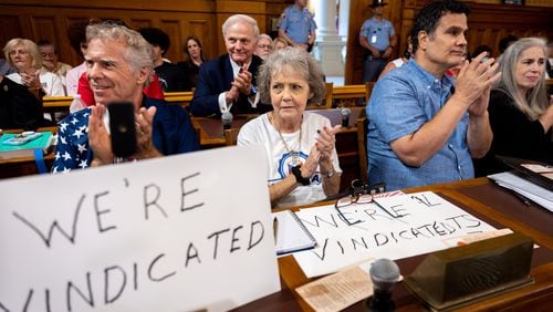 Election skeptics clap during public comment at a State Election Board board meeting at the Capitol in Atlanta on Tuesday, July 9, 2024. (Arvin Temkar / AJC)