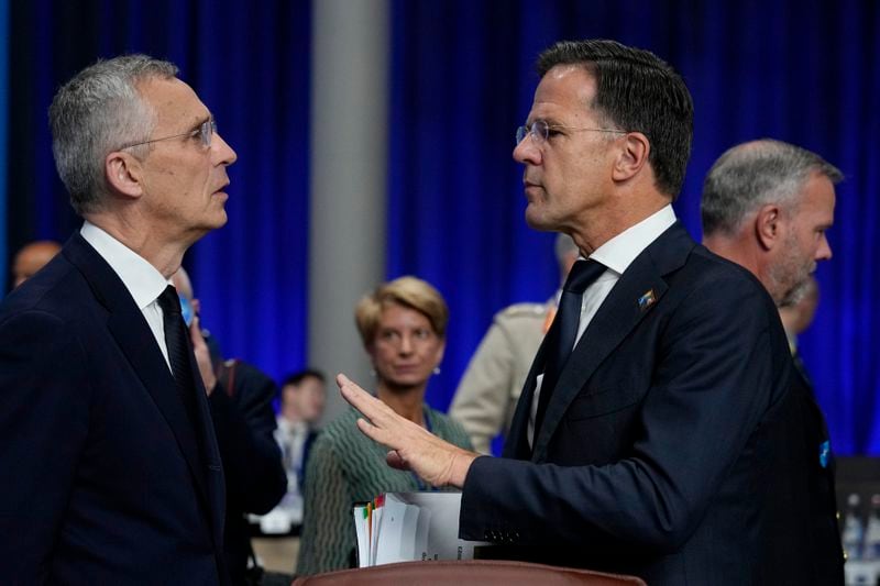 FILE - Netherland's Prime Minister Mark Rutte, right, speaks with NATO Secretary General Jens Stoltenberg during a meeting of the North Atlantic Council with Partner Nations at a NATO summit in Vilnius, Lithuania, Wednesday, July 12, 2023.Over the course of more than a dozen years at the top of Dutch politics, Mark Rutte got to know a thing or two about finding consensus among fractious coalition partners. Now he's going to bring the experience of leading four Dutch multiparty governments to the international stage as NATO's new secretary general. (AP Photo/Pavel Golovkin, File)