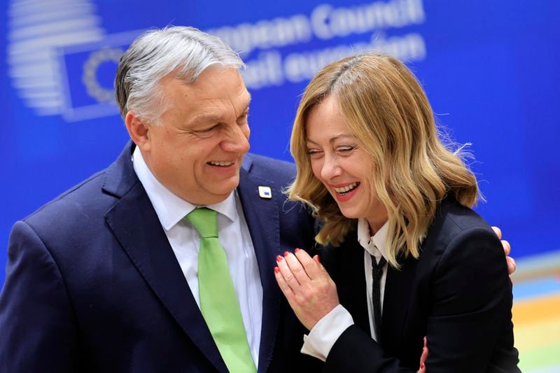 FILE - Hungary's Prime Minister Viktor Orban, left, speaks with Italy's Premier Giorgia Meloni during a round table meeting at an EU Summit in Brussels, on March 21, 2024. It seemed like a throwaway line by European Commission President Ursula von der Leyen, yet it encapsulated what is at stake for many in this week's European Union parliamentary elections — What to do with the hard right? And should it be trusted? (AP Photo/Geert Vanden Wijngaert, File)