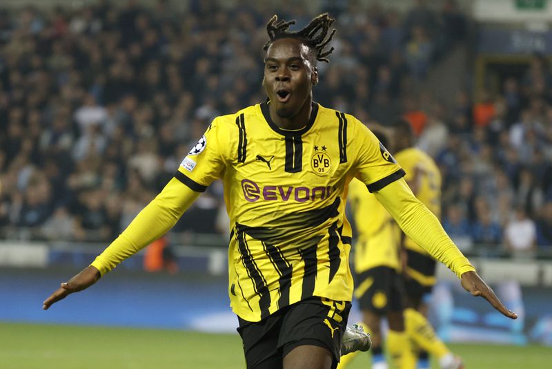 Dortmund's Jamie Gittens celebrates after he scored his second goal during the Champions League opening phase soccer match between Club Brugge and Borussia Dortmund at Jan Breydelstadion in Bruges, Belgium, Wednesday, Sept. 18, 2024. (AP Photo/Omar Havana)