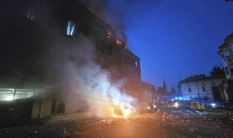 In this photo provided by the Lviv City Council, a car burns near a residential building damaged by a Russian strike in Lviv, Ukraine, Wednesday, Sept. 4, 2024.. (Lviv City Council via AP)