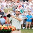 Scottie Scheffle celebrates with the FedEx Cup trophy after winning the Tour Championship at East Lake Golf Club, Sunday, Sept. 1, 2023, in Atlanta. 
(Miguel Martinez / AJC)