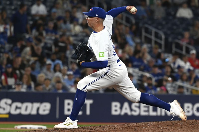 Toronto Blue Jays pitcher Chad Green throws to a Philadelphia Phillies batter in the ninth inning of a baseball game in Toronto on Tuesday Sept. 3, 2024. (Jon Blacker/The Canadian Press via AP)