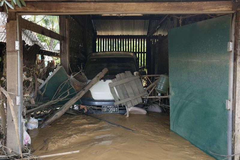 A car covered in flood debris in Naypyitaw, Myanmar, Saturday, Sept. 14, 2024. (AP Photo/Aung Shine Oo)