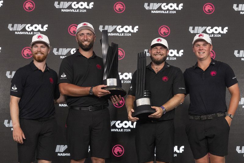 From left to right, first-place team champions Kieran Vincent, Captain Jon Rahm, Tyrrell Hatton and Caleb Surratt, of Legion XIII, celebrate with the team trophy as Hatton also holds the first-place individual champion trophy after the final round of LIV Golf Nashville at The Grove, Sunday, June 23, 2024, in College Grove, Tenn. (Mike Stobe/LIV Golf)