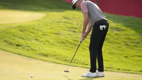 Taylor Pendrith putts on the 18th green during the second round of the 3M Open golf tournament at the Tournament Players Club, Friday, July 26, 2024, in Blaine, Minn. (AP Photo/Charlie Neibergall)