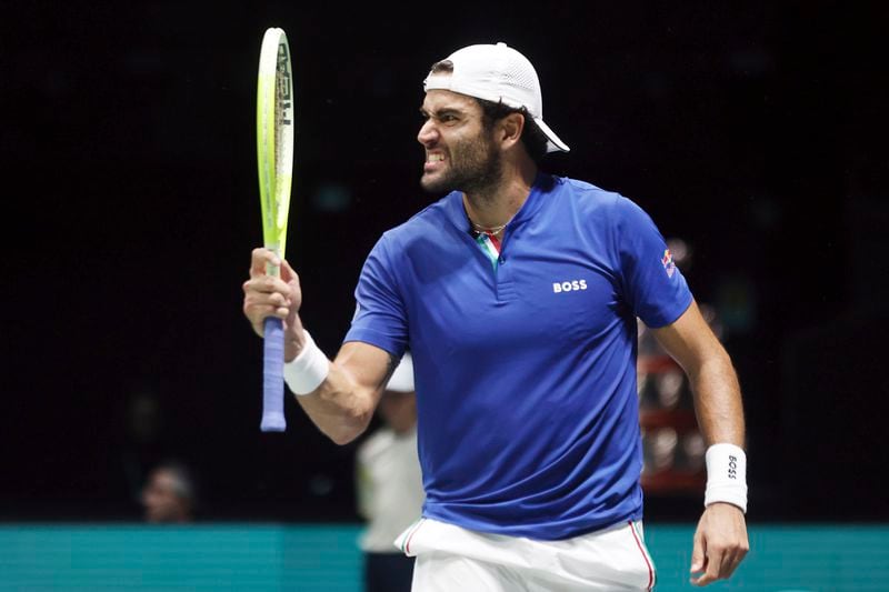 Italy's Matteo Berrettini celebrates making a point against Botic Van Zandschulp of the Netherlands during the men's singles tennis Davis Cup tennis match, at the Unipol arena, in Bologna, Italy, Sunday, Sept. 15, 2024. (Michele Nucci/LaPresse via AP)