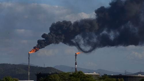 FILE - Gas is flared at the Jose Antonio Anzoategui oil complex in Barcelona, Anzoategui State, Venezuela, Tuesday, Jan. 9, 2024. (AP Photo/Matias Delacroix, File)