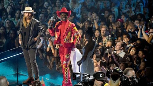 Billy Ray Cyrus and Lil Nas X speak onstage during the 2019 MTV Video Music Awards at Prudential Center on August 26, 2019 in Newark, New Jersey. (Photo by Mike Coppola/Getty Images for MTV)