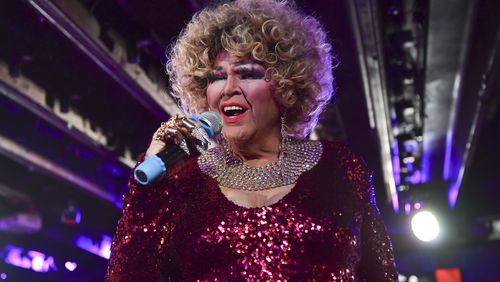 Charlie Brown, a drag performer, interacts with patrons at his show at the Atlanta Eagle. (Daniel Varnado/ For the AJC)