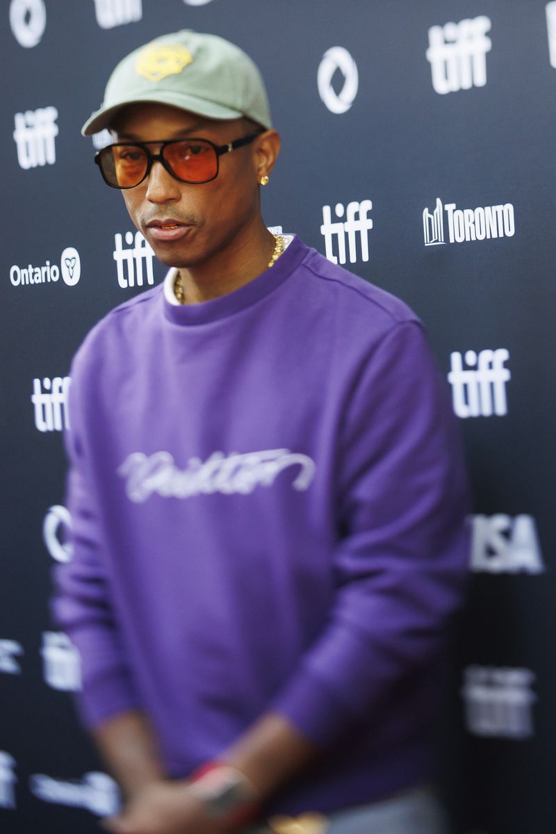 Pharrell Williams arrives on the red carpet for the premiere of "Piece by Piece" at the Princess of Wales Theatre during the Toronto International Film Festival in Toronto, Tuesday, Sept. 10, 2024. (Cole Burston/The Canadian Press via AP)